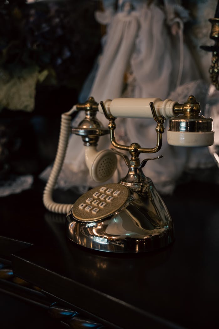 A classic gold and ivory rotary phone exuding elegance and nostalgia.